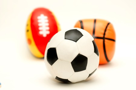 a ball of soccer in front of basketball and rugbyの写真素材