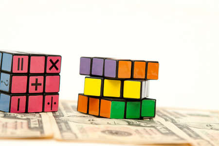 isolated cube puzzle and moneyのeditorial素材