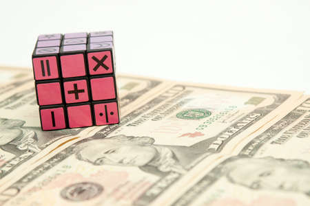 isolated cube puzzle and moneyのeditorial素材