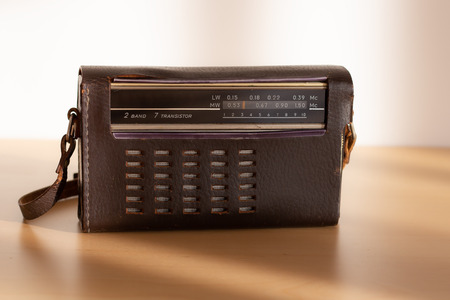 Old radio with leather case in natural light.の写真素材