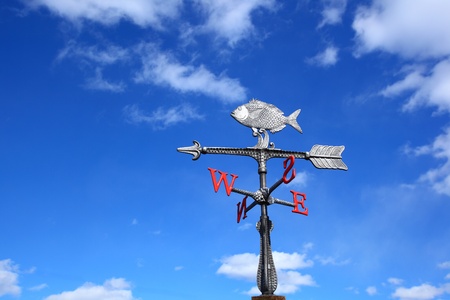 Weather vane on a backgrounds a blue skyの写真素材