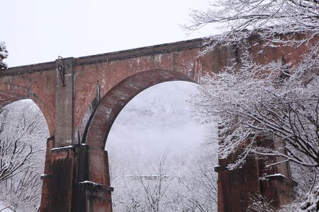 Brick arched bridge of the snow scene, Gunma, Japanの写真素材
