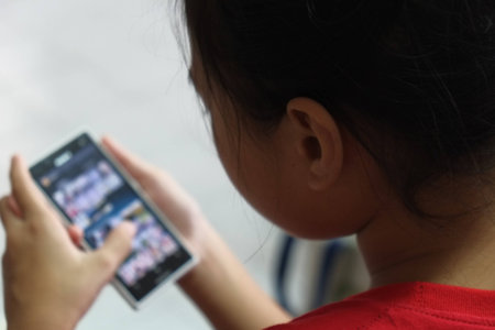 The girl browsing in a smartphoneの写真素材