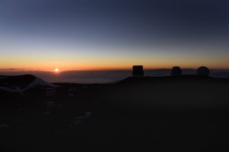 The sunset and the observatory group of the mountain top of Maunakeaの写真素材