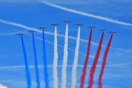 Paris, France. Bastille Day military parade. An aviation corps that flies while emitting smoke in the color of the French flag. July 14, 2022.のeditorial素材