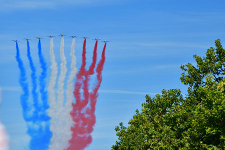 Paris, France. Bastille Day military parade. An aviation corps that flies while emitting smoke in the color of the French flag. July 14, 2022.のeditorial素材