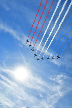 Paris, France. Bastille Day military parade. An aviation corps that flies while emitting smoke in the color of the French flag. July 14, 2022.のeditorial素材