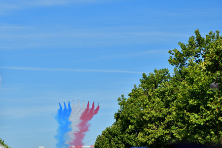 Paris, France. Bastille Day military parade. An aviation corps that flies while emitting smoke in the color of the French flag. July 14, 2022.のeditorial素材