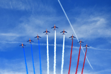 Paris, France. Bastille Day military parade. An aviation corps that flies while emitting smoke in the color of the French flag. July 14, 2022.のeditorial素材