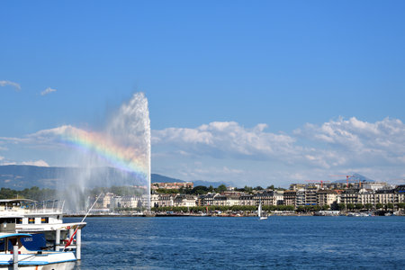 Switzerland, Geneva. A rainbow over the Jet d'Eau (Water-Jet) on Lake Geneva. . August 16, 2022.のeditorial素材
