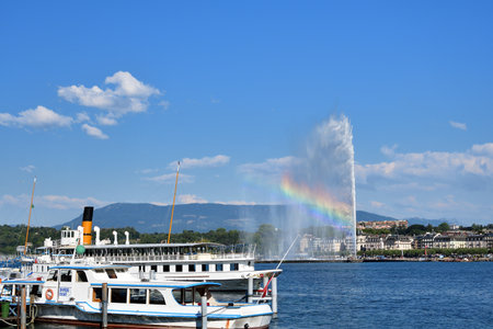Switzerland, Geneva. A rainbow over the Jet d'Eau (Water-Jet) on Lake Geneva. . August 16, 2022.のeditorial素材