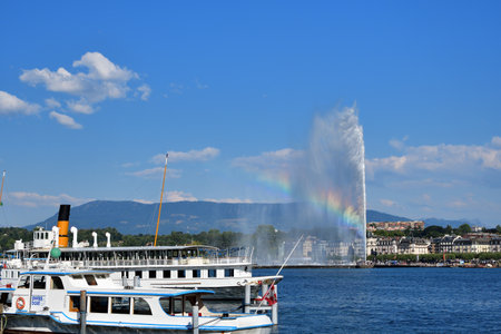 Switzerland, Geneva. A rainbow over the Jet d'Eau (Water-Jet) on Lake Geneva. . August 16, 2022.のeditorial素材