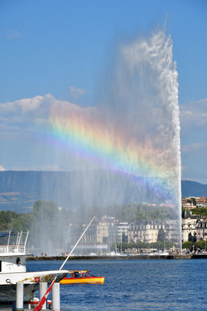 Switzerland, Geneva. A rainbow over the Jet d'Eau (Water-Jet) on Lake Geneva. . August 16, 2022.のeditorial素材