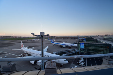 Tokyo Japan. Haneda Airport Terminal 3. View from the observation deck at dusk. August 17, 2023.のeditorial素材