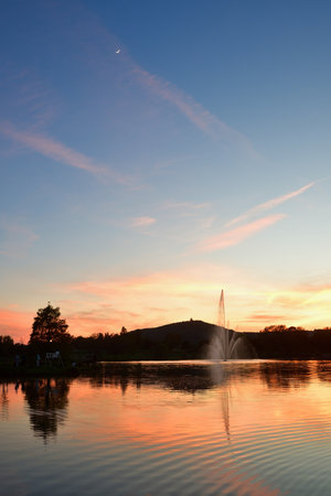 Metz, France. Plan d'Eau de Metz at magic hour with the moon. May 11, 2024.の写真素材