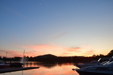 Metz, France. Plan d'Eau de Metz at magic hour with the moon. May 11, 2024.の写真素材