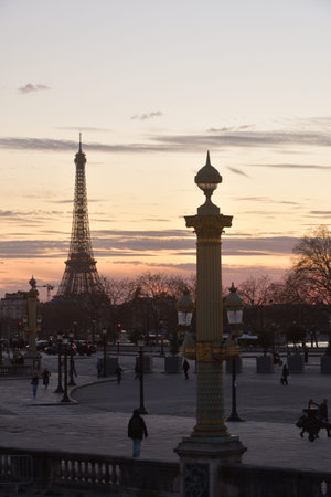 Eiffel Tower silhouette seen from Place de la Concorde at sunset, Paris, France