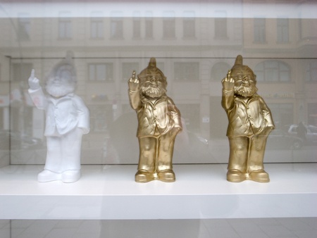 berlin,germany,20 february  2011:three dwarfs are placed on display to the outside, they humorously show the middle finger to people who stop front of the window.のeditorial素材