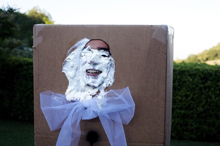marche, italy - june 21, 2008: a traditional and diffused joke, the bridegroom receive a cake in face. のeditorial素材