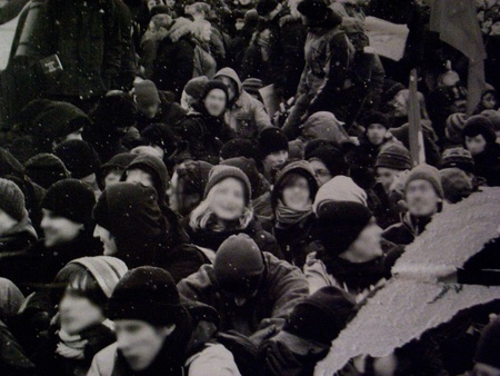 berlin, germany - february 20, 2011: detail of a poster advertising, a photo in black and white where we can see a crowd of peopleのeditorial素材