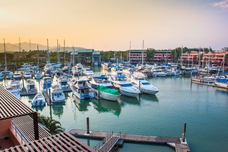 Boats and yacht docking at a harbor.