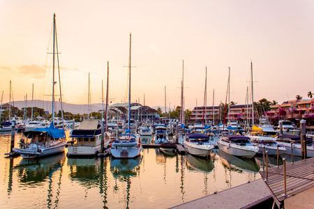 Boats and yacht docking at the harbor with sunsettingのeditorial素材