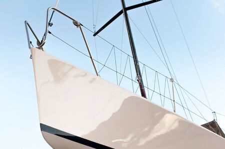 Yacht from the bottom view with blue sky behindの写真素材