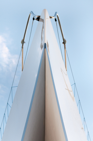 Yacht from the bottom view with blue sky behindの写真素材