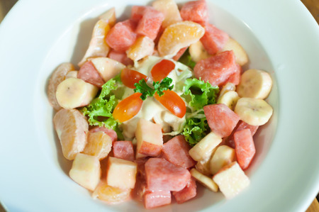 Fruit salad serve in a white dishの写真素材