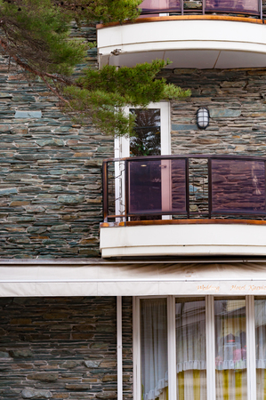 Balcony in modern building with stones wallの写真素材