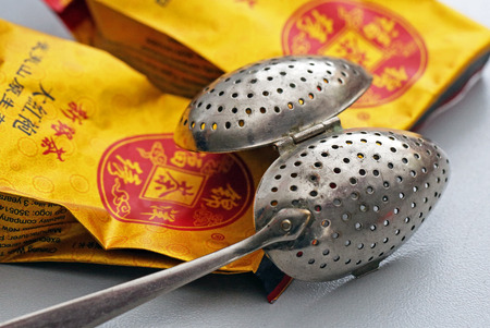 Tea bags and tea scoop on white backgroundのeditorial素材