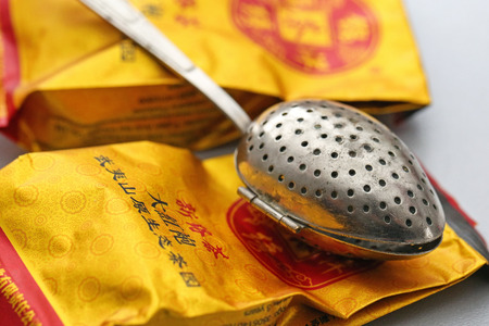 Tea bags and tea scoop on white backgroundのeditorial素材