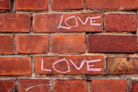 Love written on a wallの写真素材