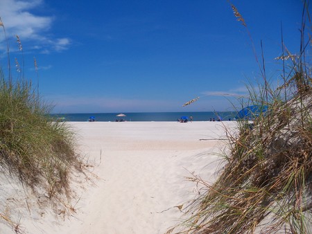 Looking at the beach between two dunesの写真素材