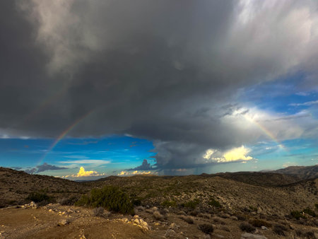 Rainbow over the desertの写真素材