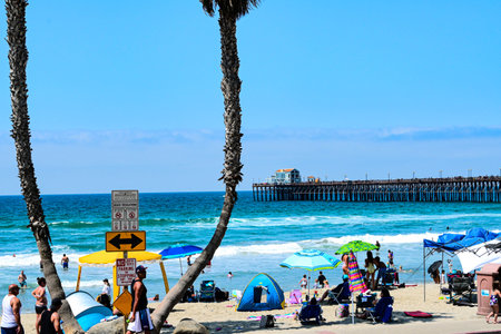 Unidentified people on the beach in San Diego, California. San Diego is the largest city in the United States.の写真素材