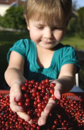 Girl with cowberriesの写真素材