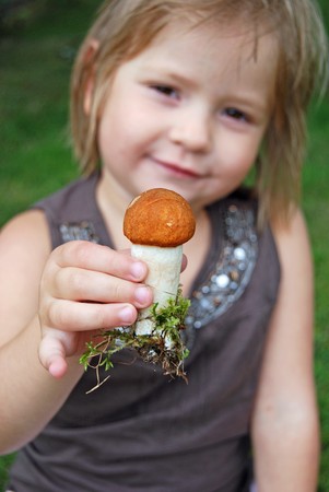 Beautiful little girl and little mushroomの写真素材