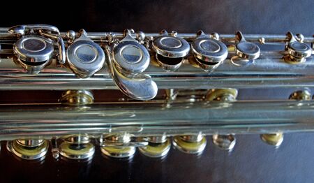 Silver flute on mirrow backgroundの写真素材
