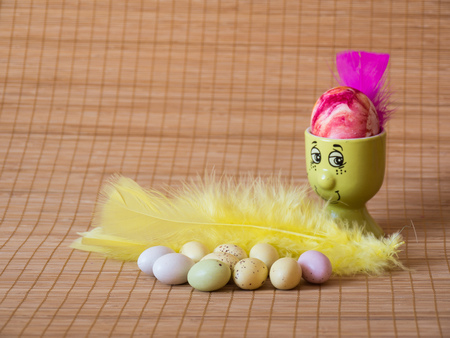 Perfect colorful handmade easter eggs on wooden backgroundの写真素材