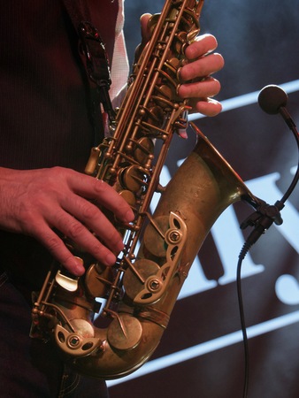 jazz day and Jazz festival. Saxophone, music instrument played by saxophonist player musician in fest.の写真素材