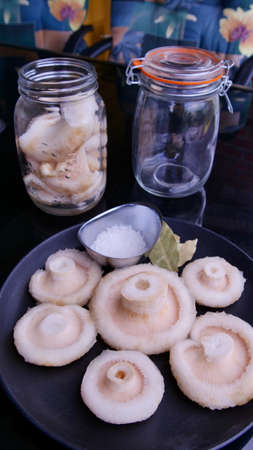 Prepare for salted mushrooms on dark backgroundの写真素材