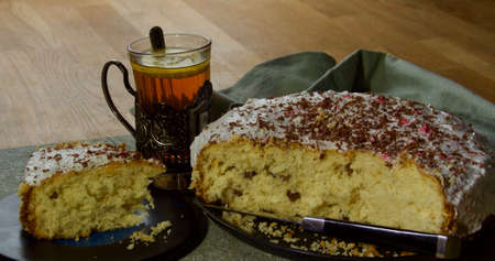 Easter cake with a tea, festive russian orthodox tradition, vintage wooden background,