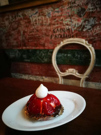 tasty rasberrty cake at restourant on dark background, Stockholm