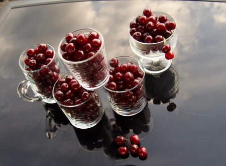 cherry compote drink on garden backgroundの写真素材