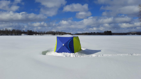 ice fishing in the North of Sweden sunise in a beautiful morningの写真素材