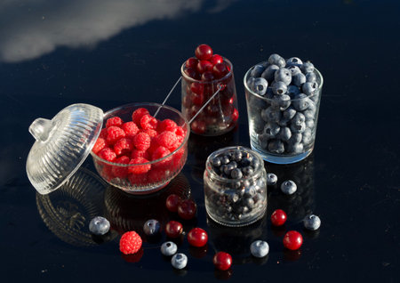 Vibrant splash of a cherry in a glass of sodaの写真素材