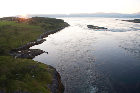 Aerial view of the Salstraumen bridge and the worlds strongest maelstrom, tidal current, in Bodo, Norwayの写真素材