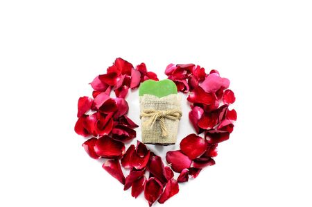 Heart of rose petals embracing green heartの写真素材
