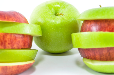 Sliced red and green apple on white backgroundの写真素材